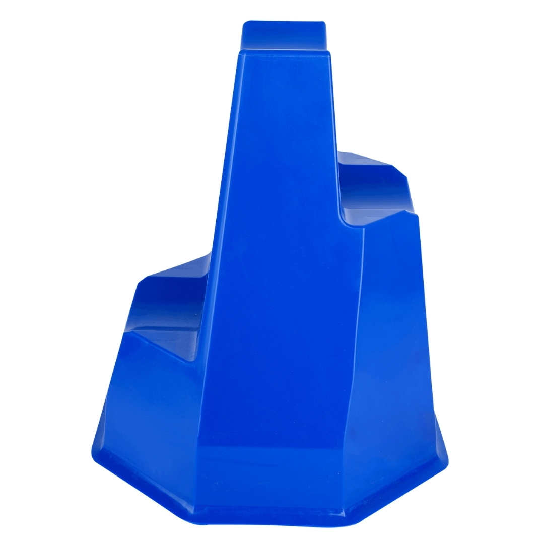 Blue plastic stepped ramp/octagonal base used for climbing drills; tall central pillar with side stair steps.