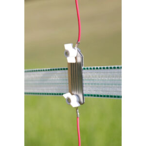 Close-up of a metal clamp with white plastic knobs attached to a green mesh fence, with red insulated wires running along the sides.