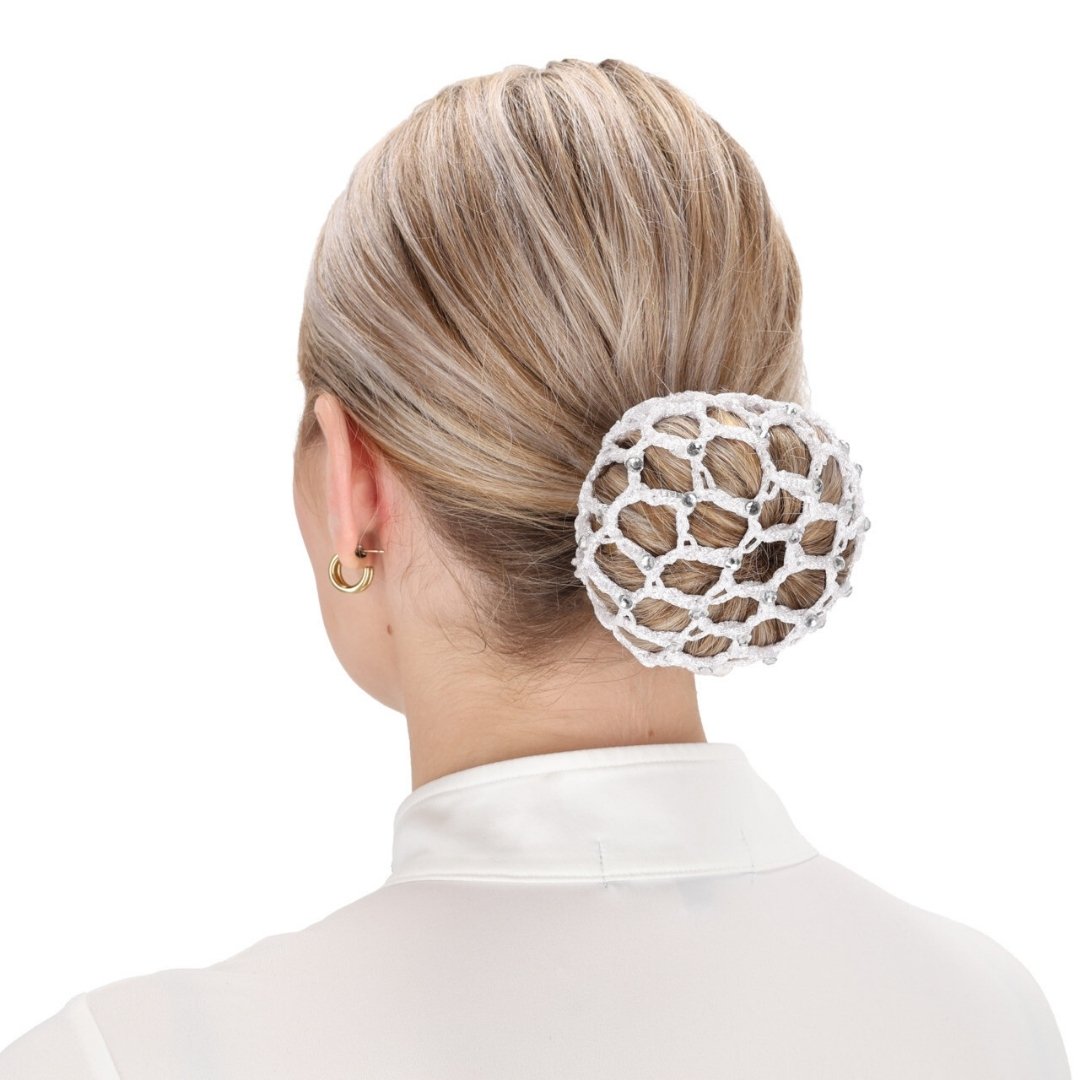Back view of a woman with blonde hair styled in a bun secured by a round white crochet hair accessory