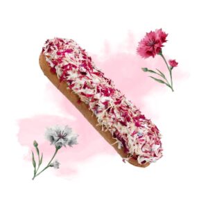 Donut coated with pink and white flower petals on a white background with pink watercolor splashes. Conveys decorative pastry with petals and soft backdrop.