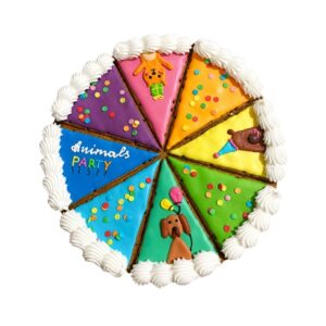 Round celebration cake divided into eight multicolored wedges with animal icing decorations and a white piped border border.