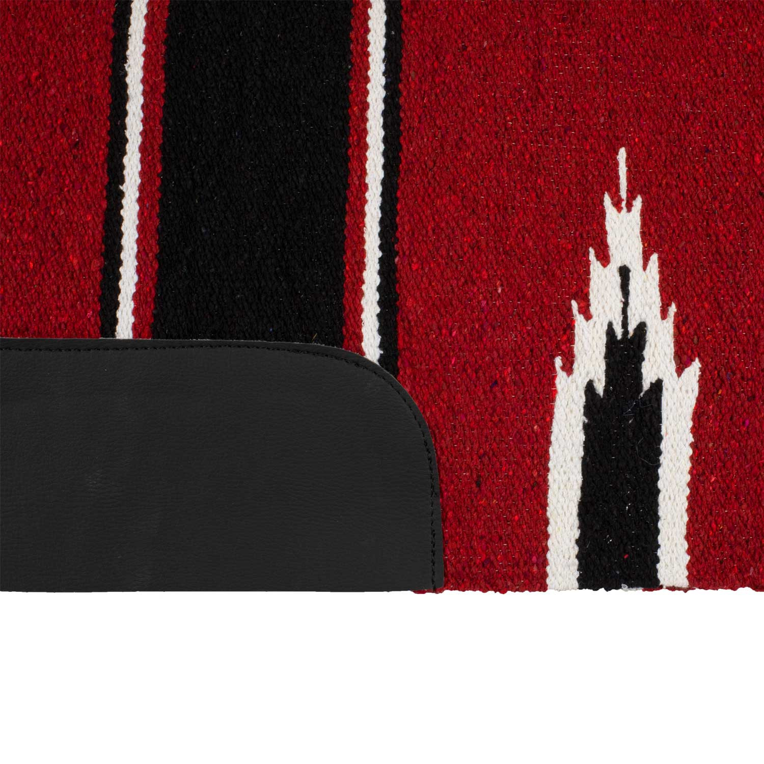 Close-up of a red woven rug with black and white vertical stripes and a black leather edge in the foreground, cropping the view.