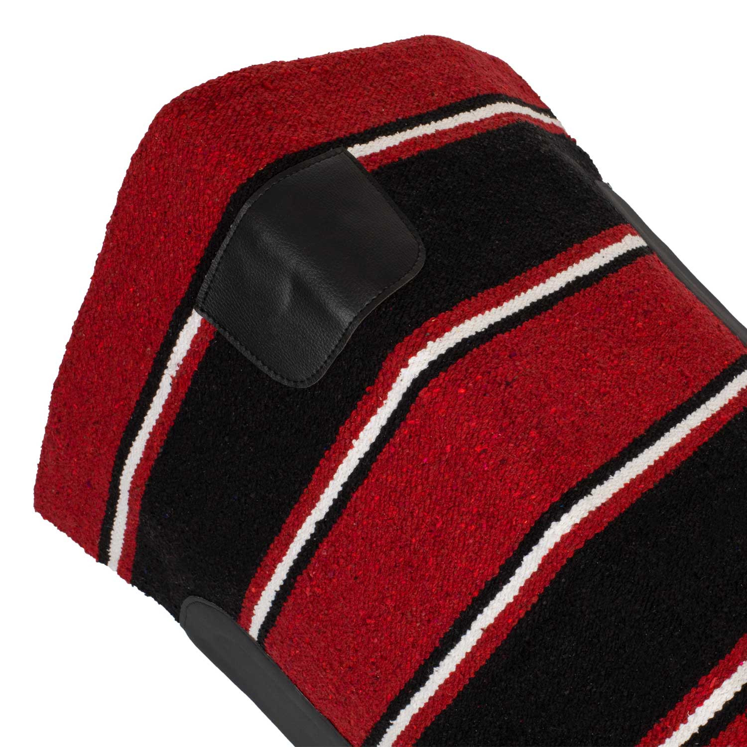 Close-up of a red and black striped fabric with a black leather patch sewn on.