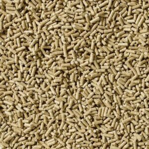 Close-up of beige cylindrical wood pellets for heating.